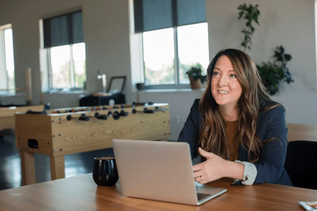 Quality control manager working on a laptop in an office