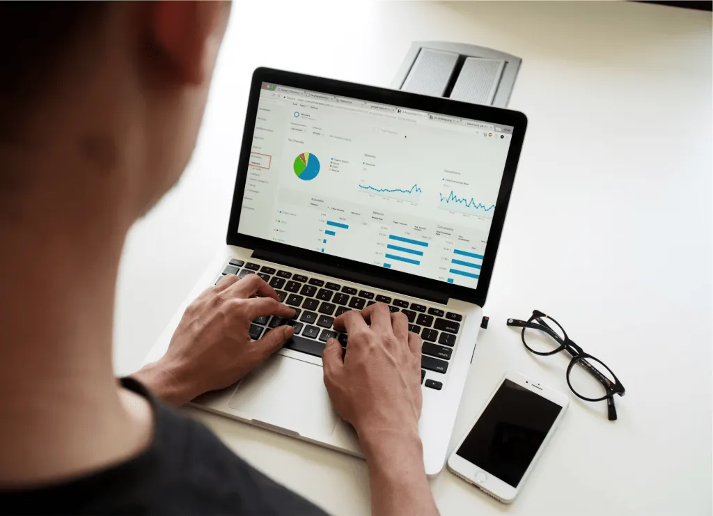 Sales manager reviewing call analytics charts on a laptop